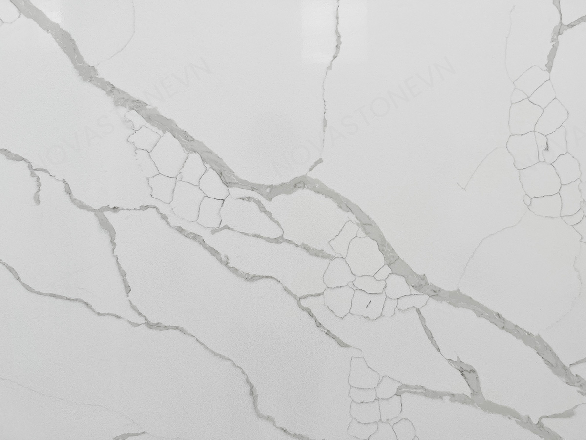 nova stone nv871 featuring a pristine bright white background with soft-to-bold gray veining that forms a natural cracked-marble effect, NV871 beautifully captures the elegance of rare Italian Calacatta marble while delivering the superior performance of premium quartz.